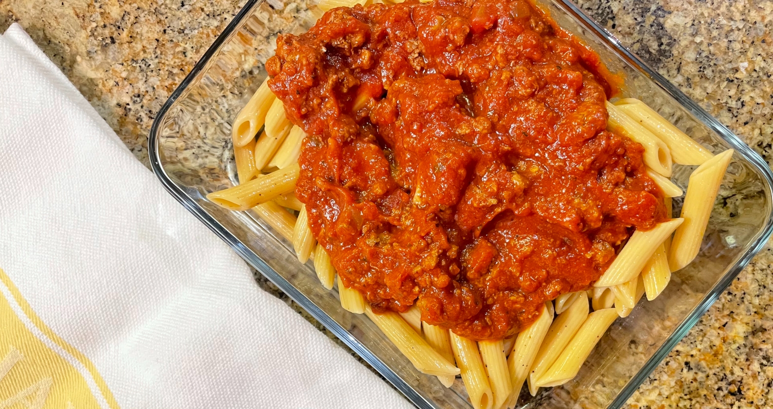 Leftover bean pasta with meat sauce makes a perfect lunch for the next day.